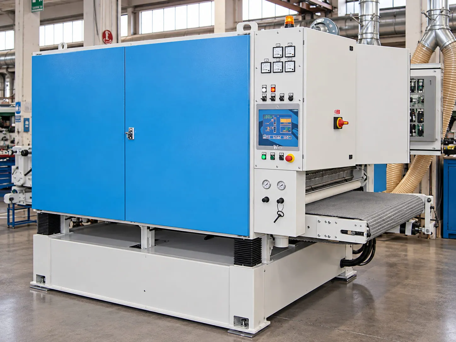 TMS technician working on a wide belt sanding machine