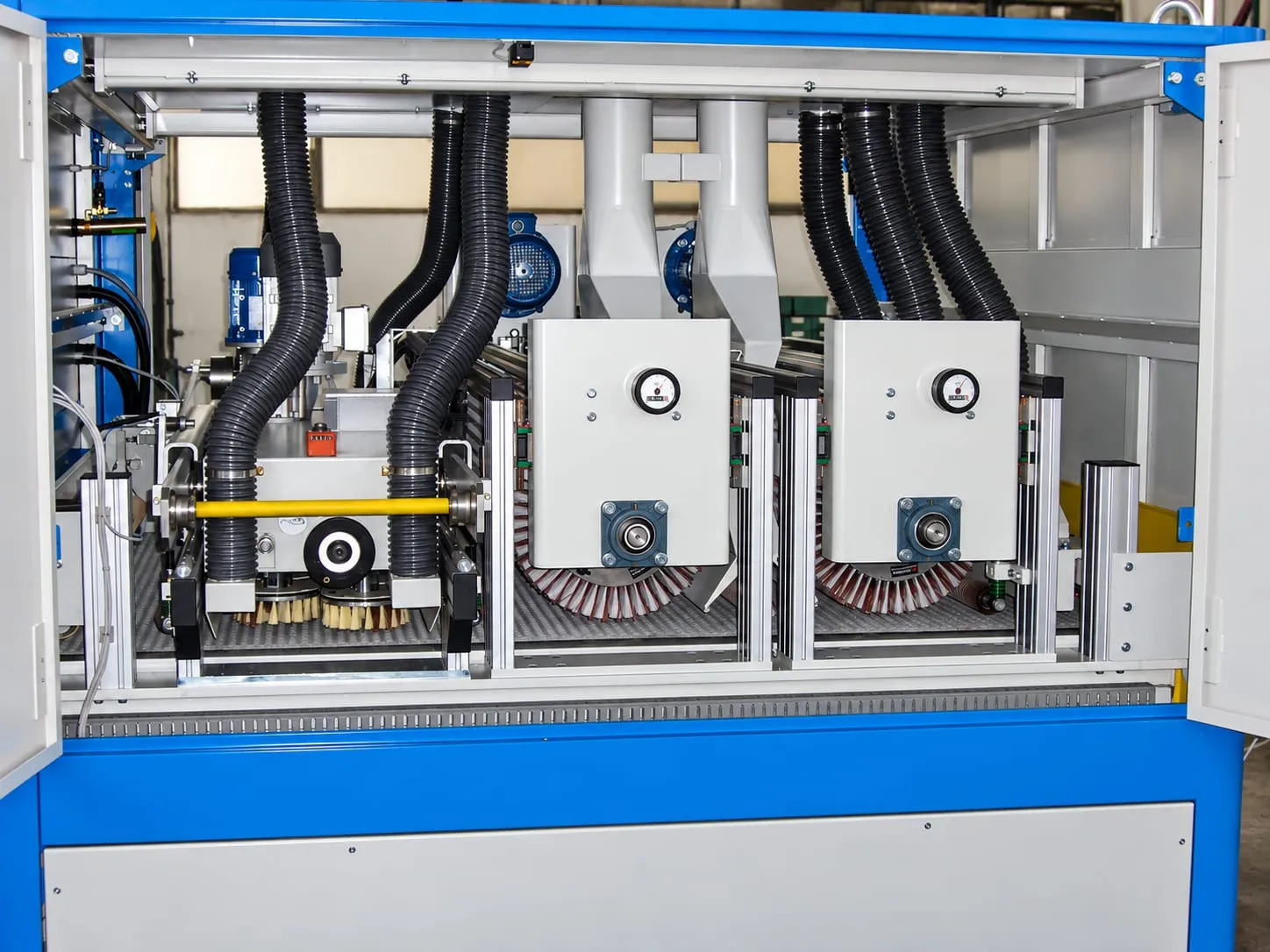 Tagliabue brushing machine opened up, with the brush units in view